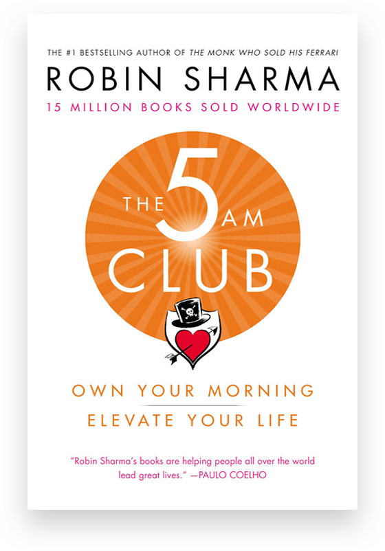 The 5 AM Club book on a desk, inspiring personal growth and productivity.