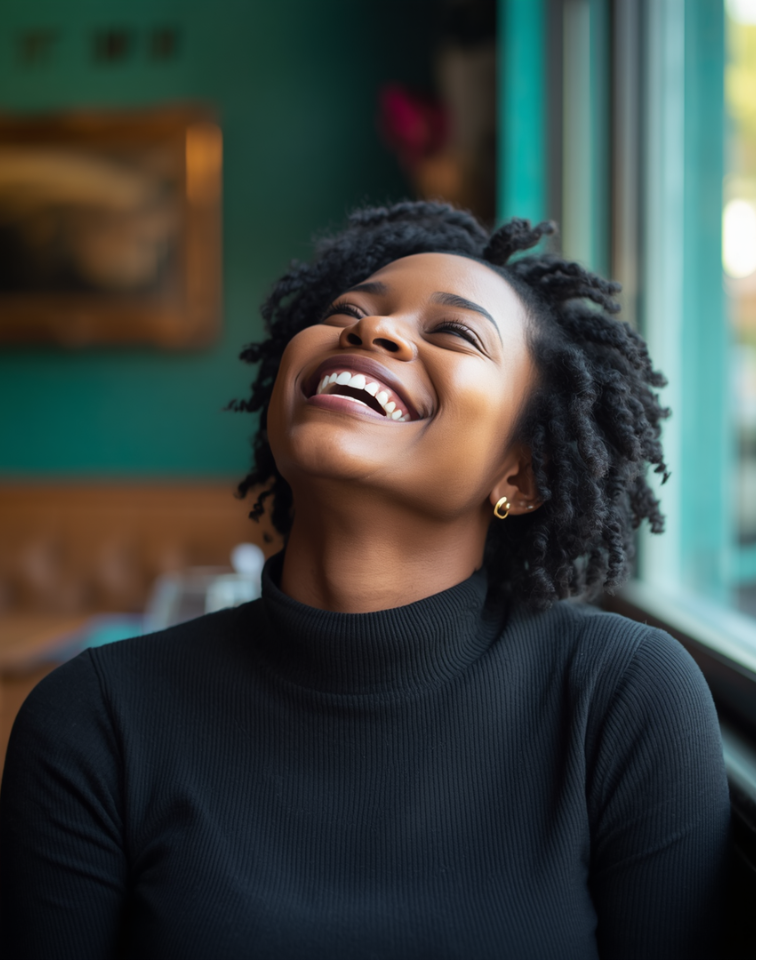 Woman laughing freely, representing the joy of reconnecting with your authentic self